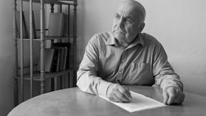 Old Man Signing Lasting Power Of Attorney