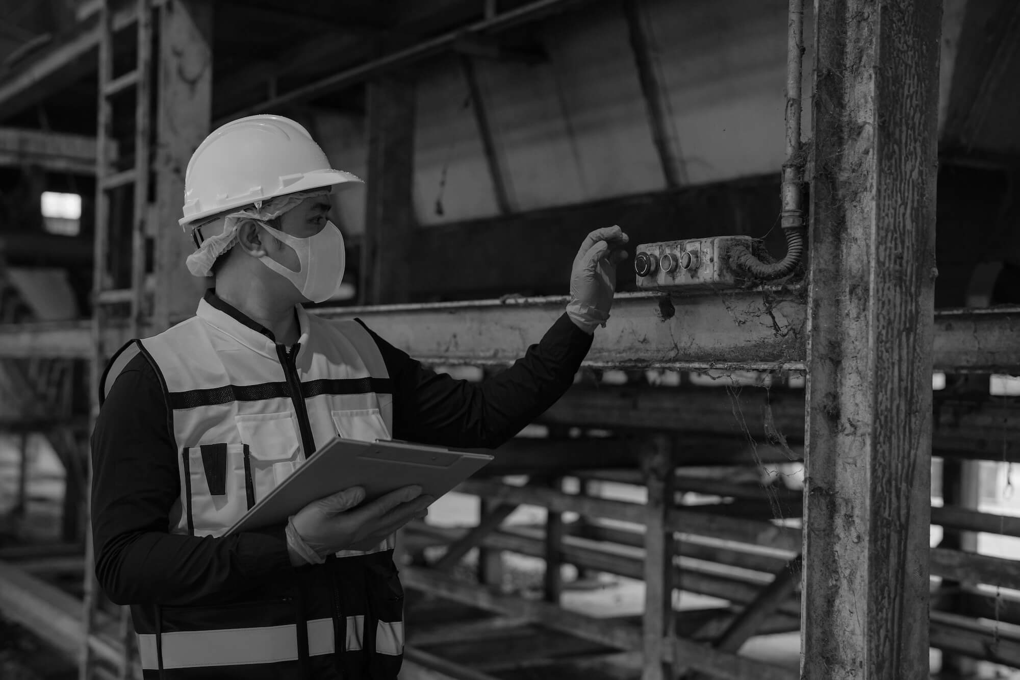 Health and safety officer conducting a workplace inspection following an incident to assess business compliance and safety procedures