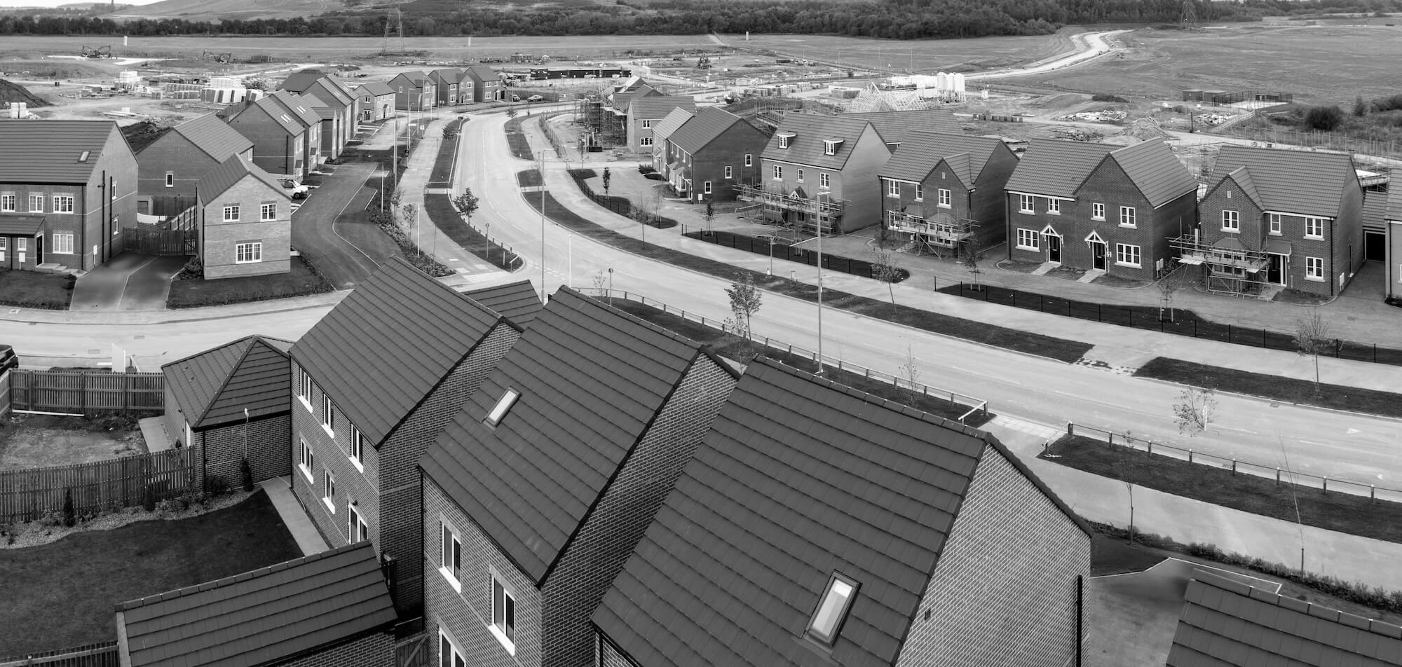 Modern UK new-build houses representing Persimmon Homes properties eligible for freehold purchase.