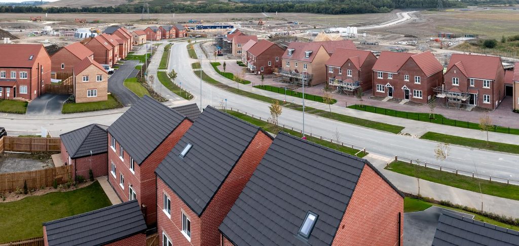 Modern UK new-build houses representing Persimmon Homes properties eligible for freehold purchase.